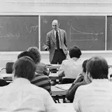 A black and white photo of former Yale SOM dean Burton Malkiel in the classroom