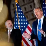 President-elect Donald Trump, accompanied by Trump's choice for Secretary of Commerce, Cantor Fitzgerald Chairman and CEO Howard Lutnick, speaks at a news conference at Trump's Mar-a-Lago resort on December 16, 2024 in Palm Beach, Florida.