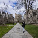 A student walks through Library Walk at Yale University campus in New Haven, Connecticut, on Sunday April 7, 2024.