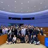 A group of students posing in a classroom