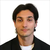 A person with short hair against a white background