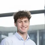 A person wearing a button-down shirt