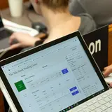 Students with open screens playing the Yale Stock Trading Game